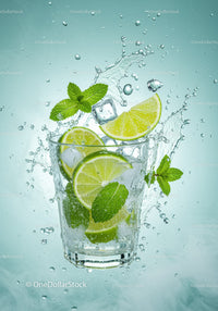 Refreshing lime and mint drink with ice in glass
