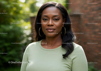 Confident woman standing outdoors with natural light