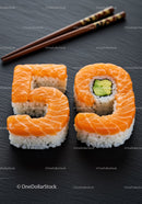 Creative sushi shaped as number fifty on black plate