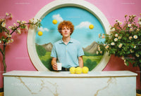 Young Man with Coffee and Tennis Balls in Vibrant Whimsical Scene