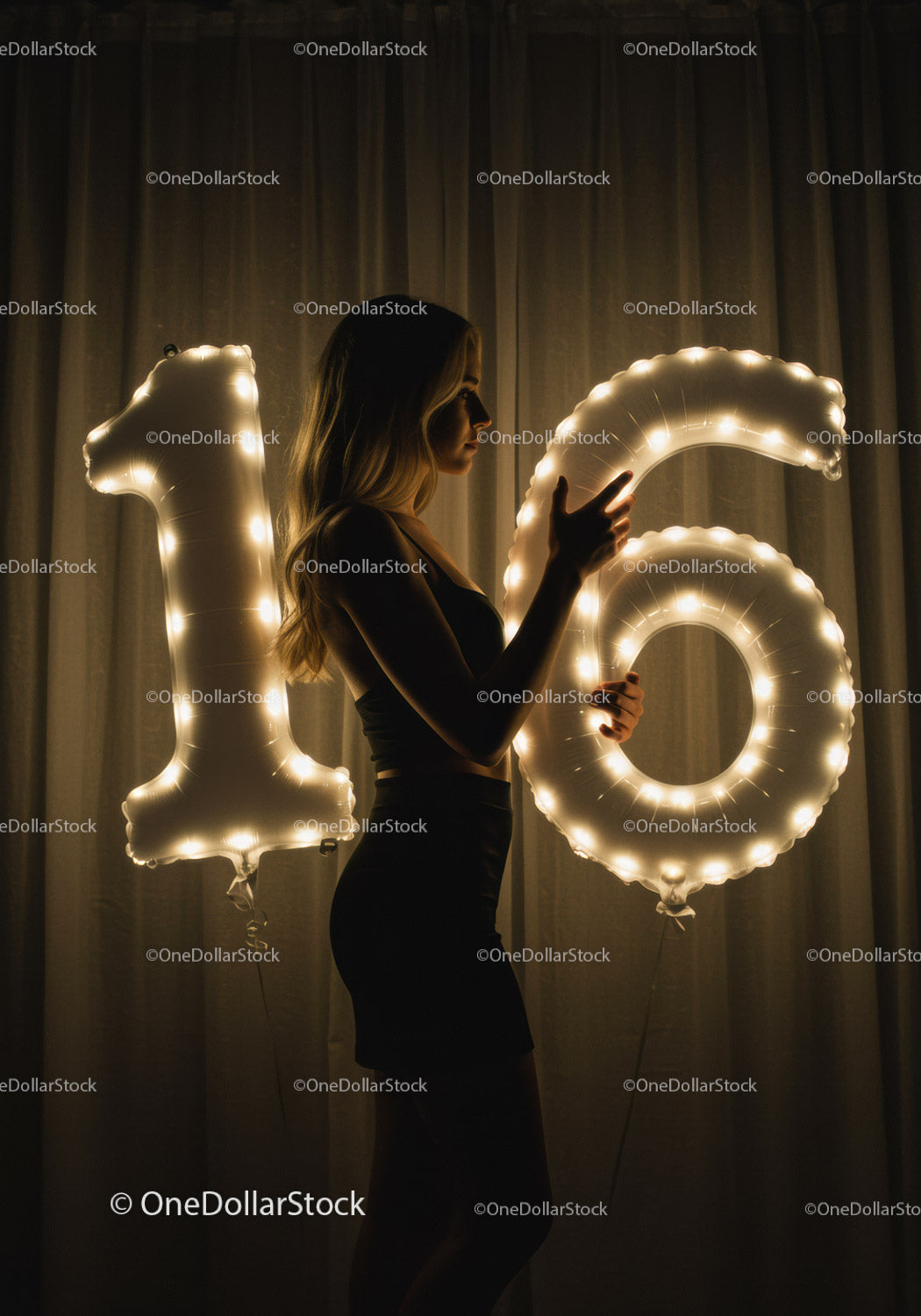 Young woman celebrating sixteenth birthday with lights