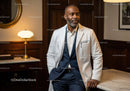 Professional African American Male Doctor in White Coat and Suit in Modern Medical Office
