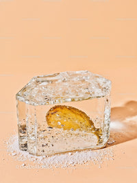 Frozen Lemon Slice Embodied in Clear Ice Block