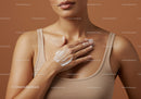 Close-up of Woman Applying Lotion on Chest in Skincare Routine