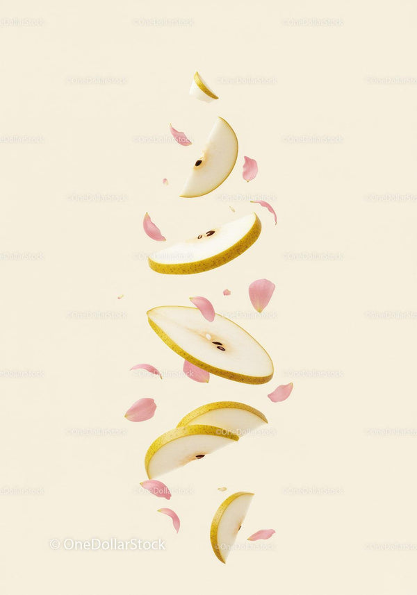 Floating slices of fresh pear with delicate pink petals
