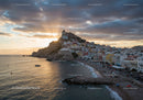Scenic Coastal Town with Colorful Buildings and Sunset Sky