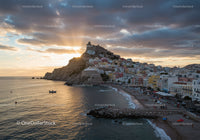 Scenic Coastal Town with Colorful Buildings and Sunset Sky