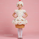 Little girl wearing creative cupcake costume on pink