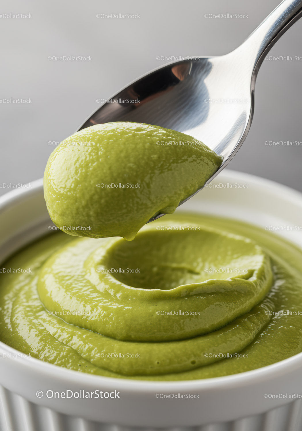 Smooth Green Avocado Dip Served in White Bowl