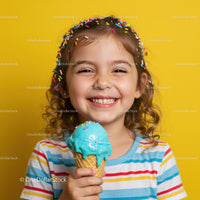 Smiling girl enjoying colorful ice cream cone