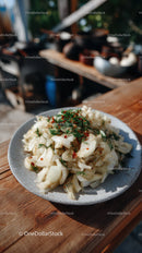 Fresh Pickled Onions with Herbs on Rustic Wooden Table