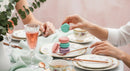 Elegant Tea Party Scene with Pastel Macarons and Fine Tableware