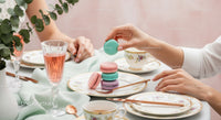 Elegant Tea Party Scene with Pastel Macarons and Fine Tableware