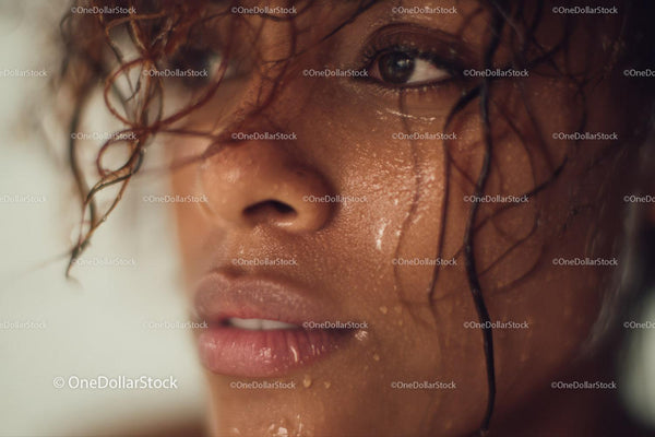Close-Up of Water-Drenched Human Face with Intense Expression