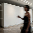 Blurred silhouette of woman walking in modern interior