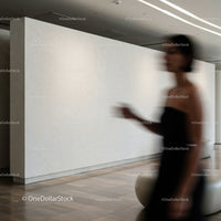 Blurred silhouette of woman walking in modern interior