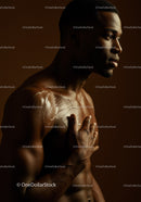 Male Model with Silver Body Art in Dramatic Studio Shot