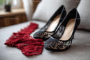 Chic Black Heels and a Red Lace Dress in a Cozy Bedroom Setting