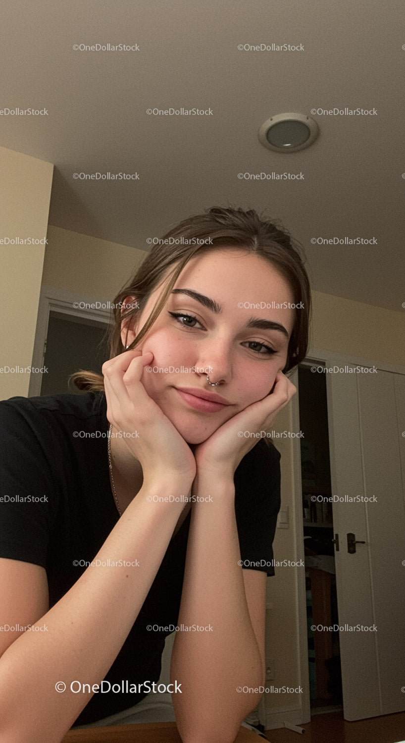 Young woman relaxing at home with a gentle smile