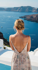 Woman enjoying scenic blue sea view from white terrace