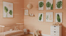 Modern Baby Nursery with Monstera Leaf Wall Art and Wooden Crib