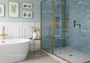 Elegant bathroom with freestanding tub and gold accents