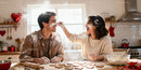 Couple Playfully Baking Heart Cookies Together