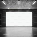 Empty industrial space with large illuminated wall panel