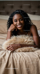 Relaxed woman smiling while lying on cozy bed