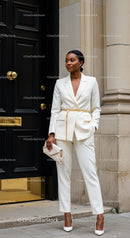 Confident woman in elegant white tailored suit outdoors