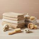 Stack of Soft Towels with Natural Bath Brushes