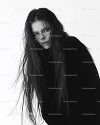 Black and White Portrait of a Woman with Long Wet Hair and Intense Gaze