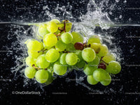 Fresh Green and Red Grapes Splashing into Water