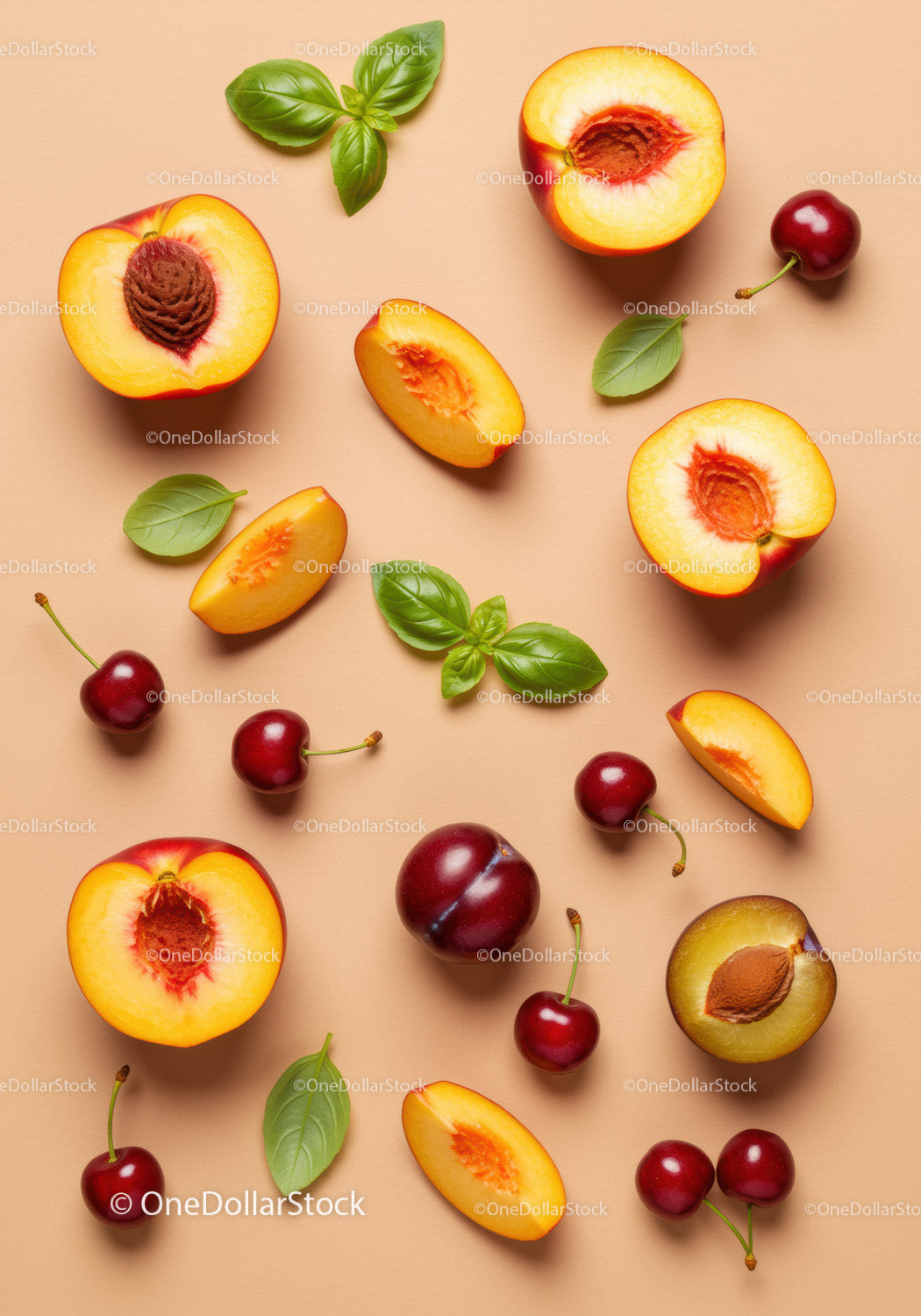 Fresh summer stone fruits with vibrant basil leaves
