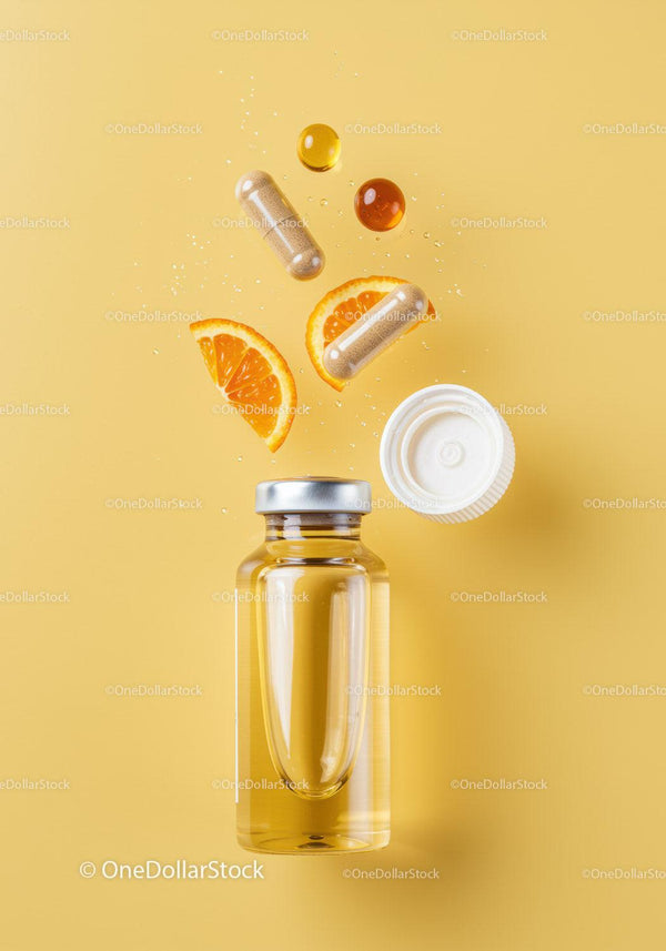 Vitamin Supplements and Orange Slices on Yellow Background