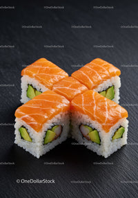 Fresh Salmon Sushi Rolls with Avocado on Dark Slate