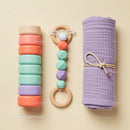 Colorful Baby Toys and Rolled Lavender Blanket Set
