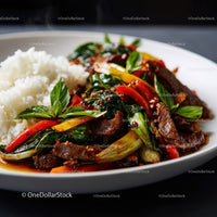Stir-Fried Beef with Bell Peppers and Bok Choy on a White Plate