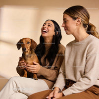 Happy friends enjoying time together with a small dog