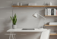 Minimalist Home Office with Green Snake Plant and Wooden Shelves