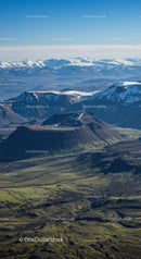 Majestic Snow-Capped Mountains with Green Valleys and Rugged Terrain