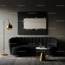 Modern living room with black sofa and gold accents