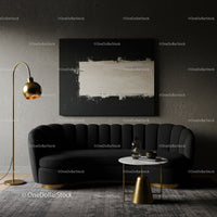 Modern living room with black sofa and gold accents