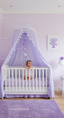 Purple Canopy in Cozy Nursery with Baby Girl and Wall Art