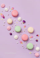 Pastel macarons with meringue and flower petals