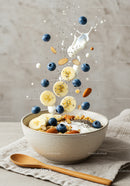 Healthy breakfast bowl with fresh fruits and yogurt splash