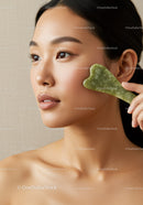 Asian Woman with Flawless Skin Using Green Jade Facial Roller