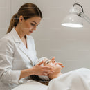 Professional Facial Treatment Scene with Woman Receiving Skin Care