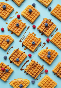 Delicious waffles with berries and caramel drizzle