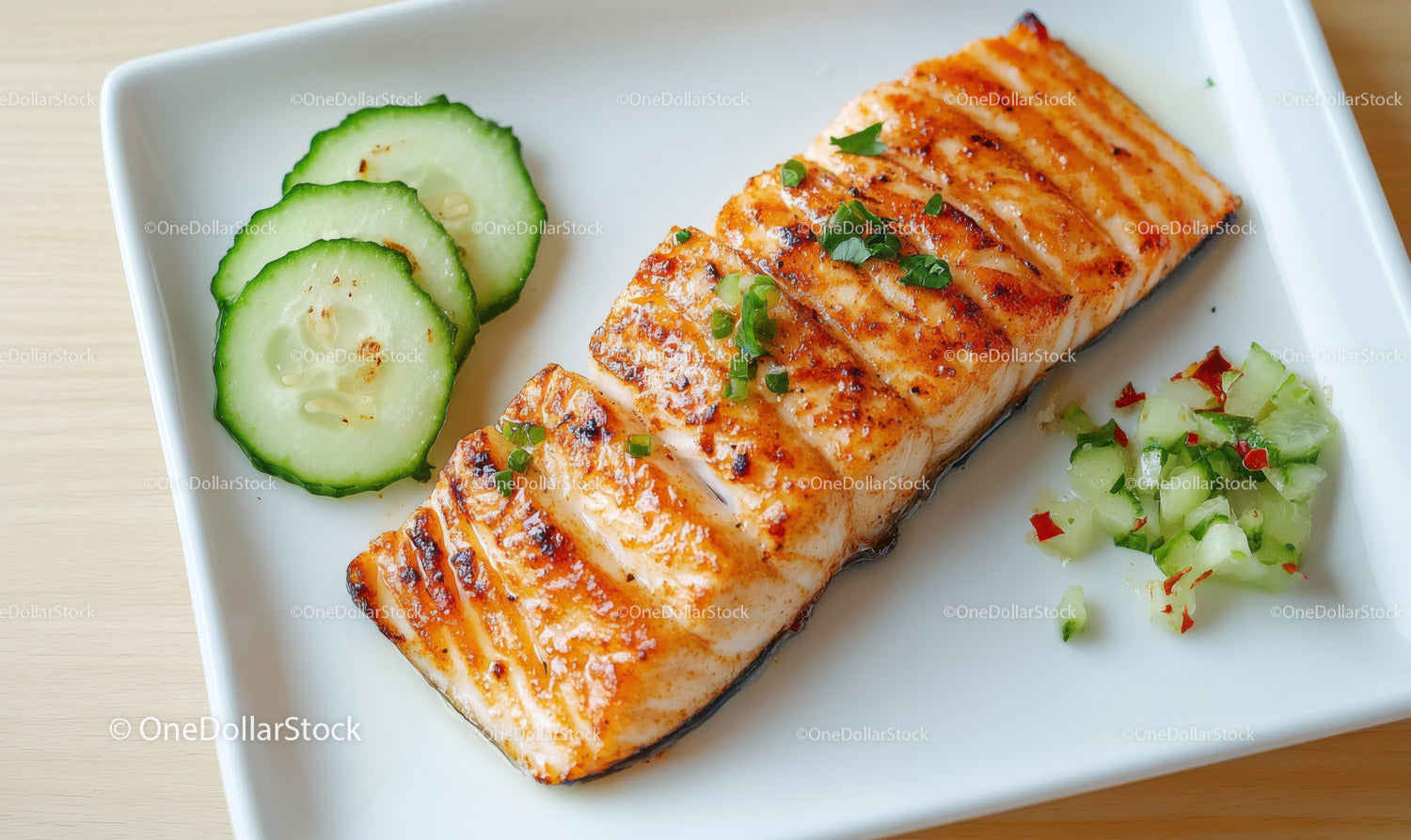 Grilled Salmon with Cucumber Slices and Vegetable Garnish